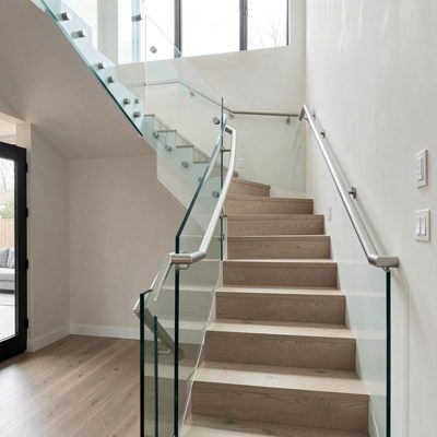 a modern staircase with glass balustrade