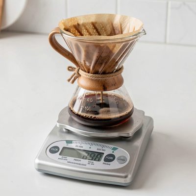 a pour over dripper on a set of scales