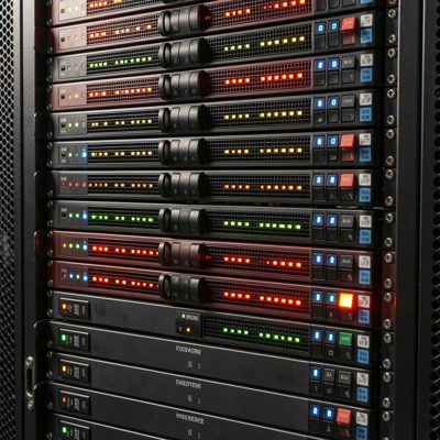 a rack of storage arrays with rows of drive lights