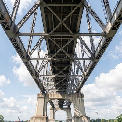a steel bridge span photographed from below