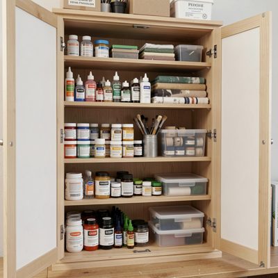 art supply cabinet neatly organized