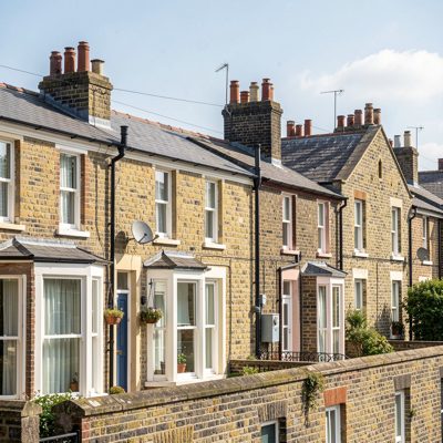 a row of terraced houses with chimney pots