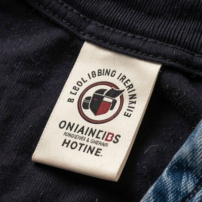 a clothing tag with a printed logo