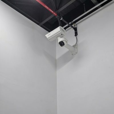 a ptz camera mounted high in a corner of a studio