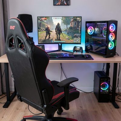 a gaming setup photographed from behind the chair