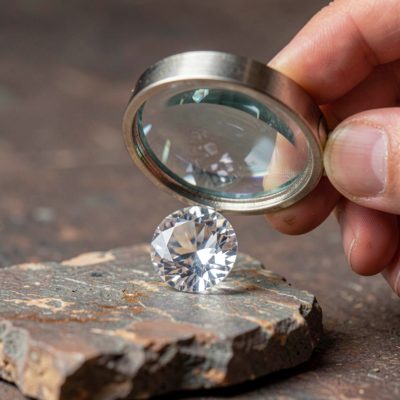 a loupe held over a gemstone
