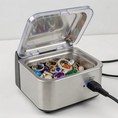 an ultrasonic cleaner with jewelry inside