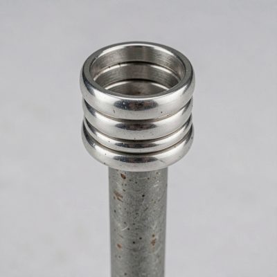 a stack of silver rings on a peg