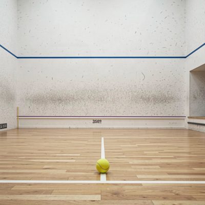 a squash court with a ball against the wall