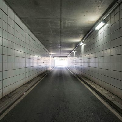 an underpass with tiled walls